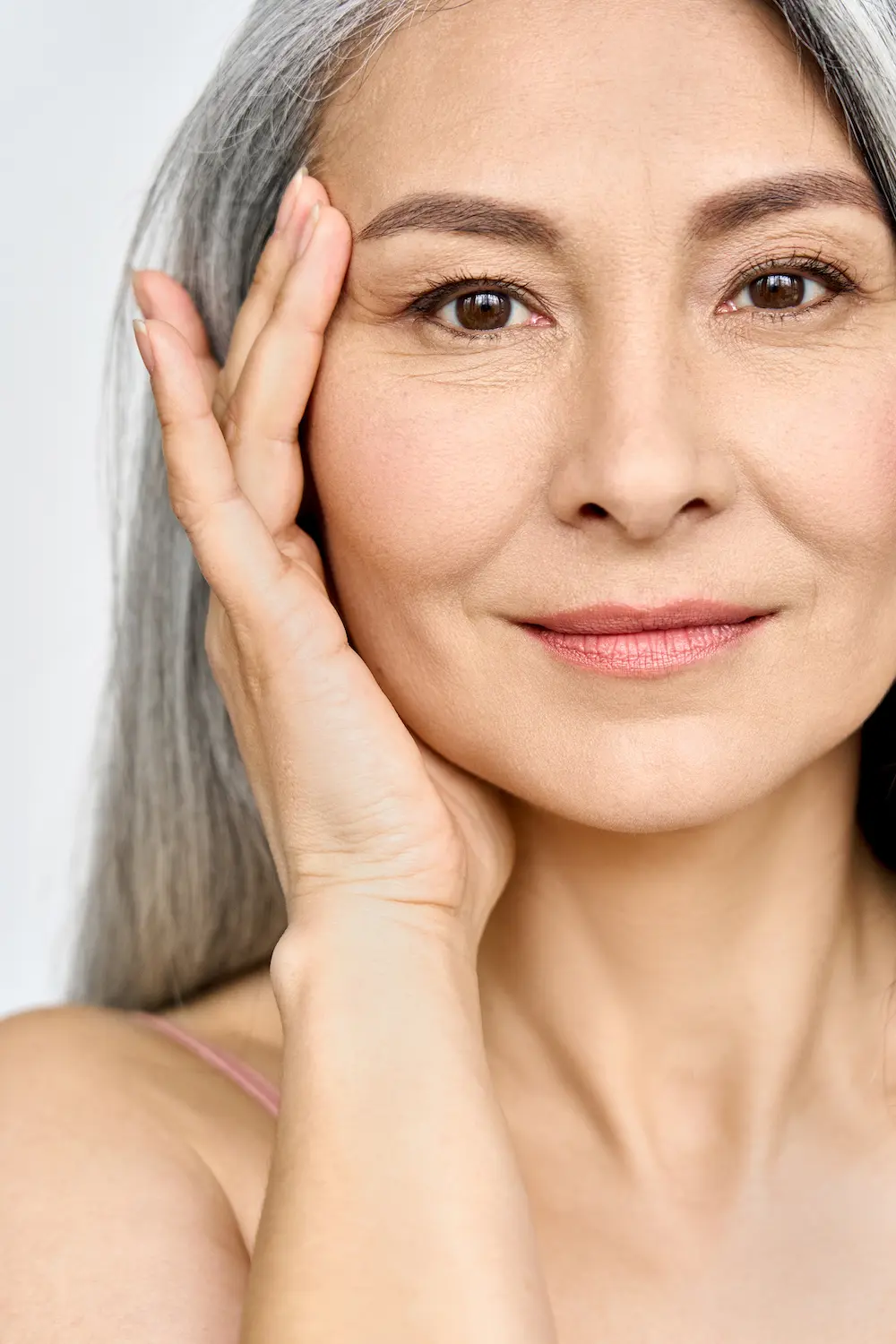 A woman smiling with a friendly expression