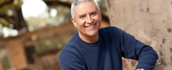 Man smiling after an eye check-up