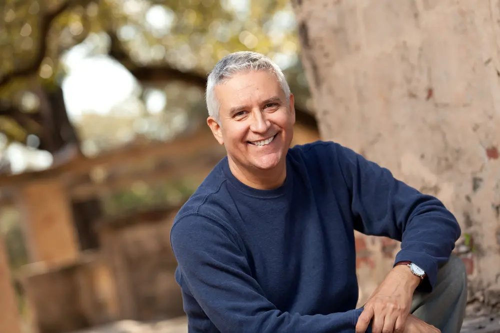 Man smiling after an eye check-up